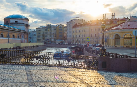 View of Saint-Petersburg pavement street in Old Town at sunset. Russia