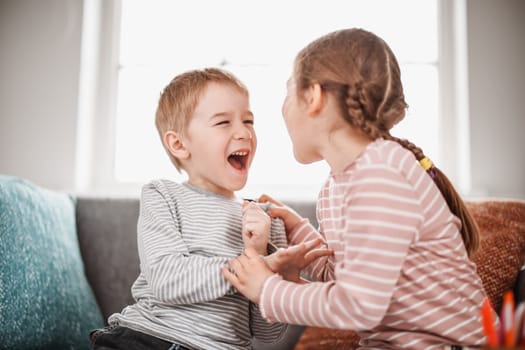 Two little kids having fight at home. Concept of the family relationship and friendship