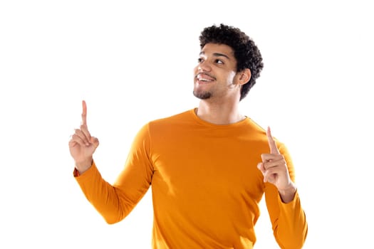 Young black afro guy laughing and pointing to something with his finger isolated on a white background
