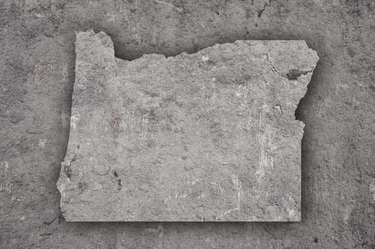 Map of Oregon on weathered concrete