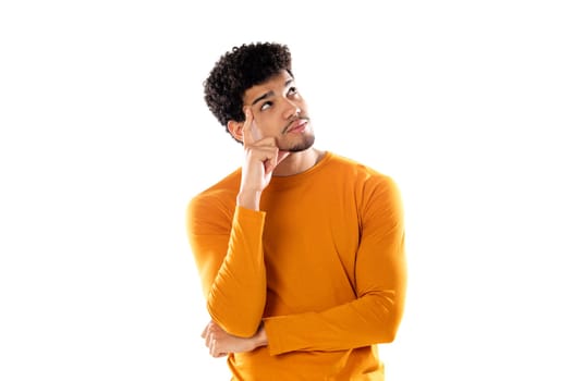 Cute african american man with afro hairstyle wearing a orange T-shirt isolated on a white background