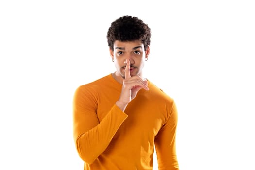 Cute african american man with afro hairstyle wearing a orange T-shirt isolated on a white background