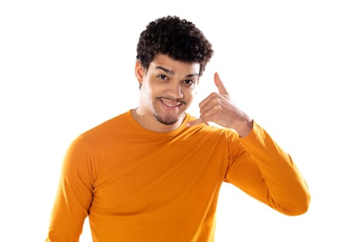 Cute african american man with afro hairstyle wearing a orange T-shirt isolated on a white background