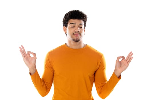 Cute african american man with afro hairstyle wearing a orange T-shirt isolated on a white background