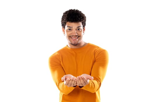 Smiling afro guy offering something isolated on a white background