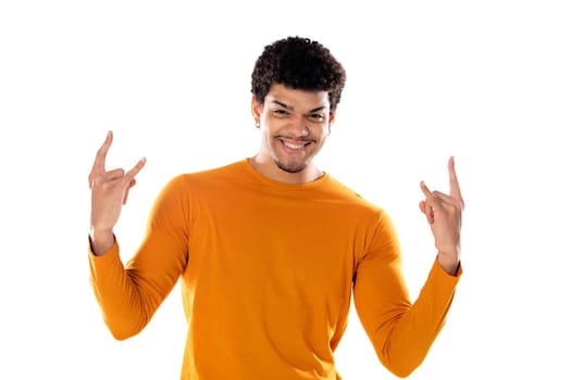 Cute african american man with afro hairstyle wearing a orange T-shirt isolated on a white background