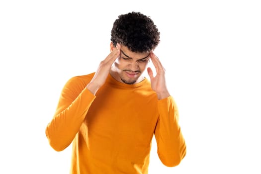 Cute african american man with afro hairstyle wearing a orange T-shirt isolated on a white background