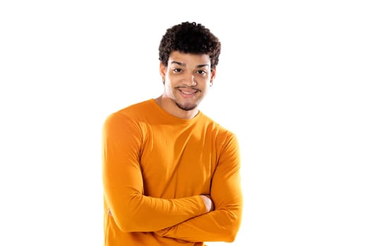 Smiling young man with afro hair wearing orange sweater isolated on a white background