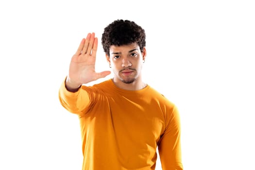Cute african american man with afro hairstyle wearing a orange T-shirt isolated on a white background