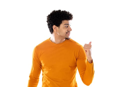 Cute african american man with afro hairstyle wearing a orange T-shirt isolated on a white background