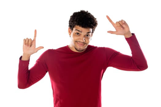 Cute african american man with afro hairstyle wearing a burgundy T-shirt isolated on a white background