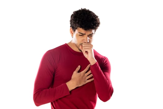 Cute african american man with afro hairstyle wearing a burgundy T-shirt isolated on a white background