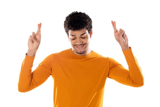 Cute african american man with afro hairstyle wearing a orange T-shirt isolated on a white background