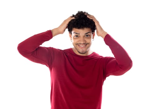 Cute african american man with afro hairstyle wearing a burgundy T-shirt isolated on a white background