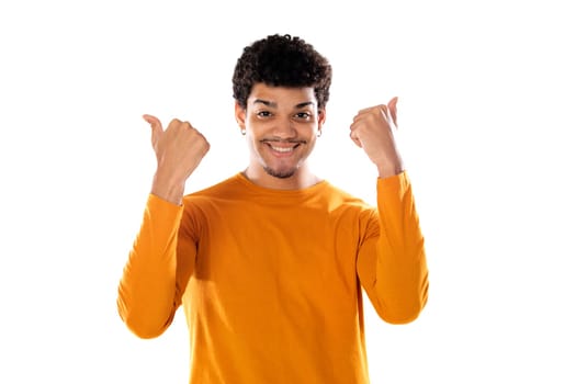 Cute african american man with afro hairstyle wearing a orange T-shirt isolated on a white background