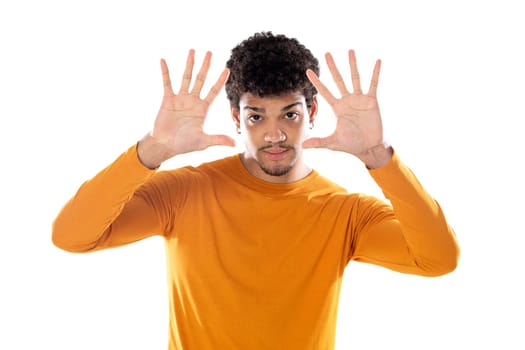 Cute african american man with afro hairstyle wearing a orange T-shirt isolated on a white background