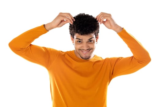 Cute african american man with afro hairstyle wearing a orange T-shirt isolated on a white background