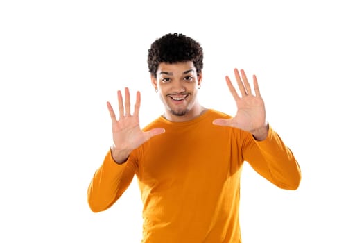 Cute african american man with afro hairstyle wearing a orange T-shirt isolated on a white background