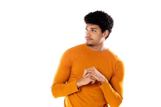 Cute african american man with afro hairstyle wearing a orange T-shirt isolated on a white background