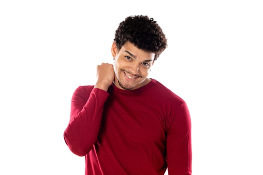 Cute african american man with afro hairstyle wearing a burgundy T-shirt isolated on a white background