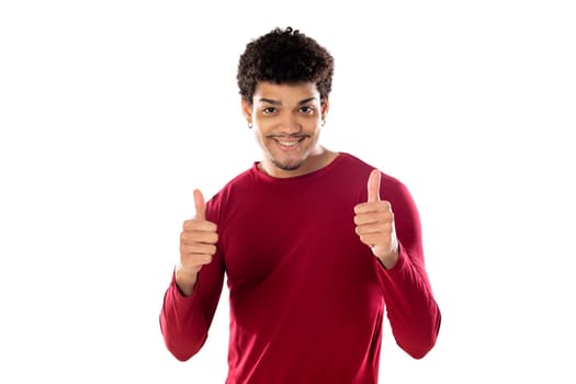 Cute african american man with afro hairstyle wearing a burgundy T-shirt isolated on a white background