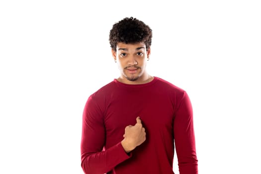 Cute african american man with afro hairstyle wearing a burgundy T-shirt isolated on a white background
