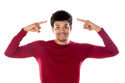 Cute african american man with afro hairstyle wearing a burgundy T-shirt isolated on a white background