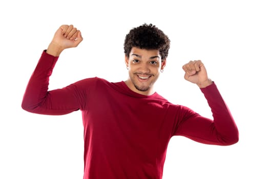 Cute african american man with afro hairstyle wearing a burgundy T-shirt isolated on a white background