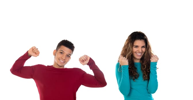 Attractive happy winner young multiethnic couple isolated on a white background