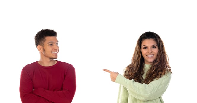 Attractive happy young multiethnic couple isolated on a white background