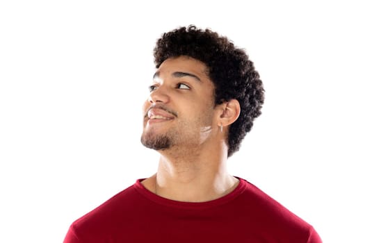 Cute african american man with afro hairstyle wearing a burgundy T-shirt isolated on a white background