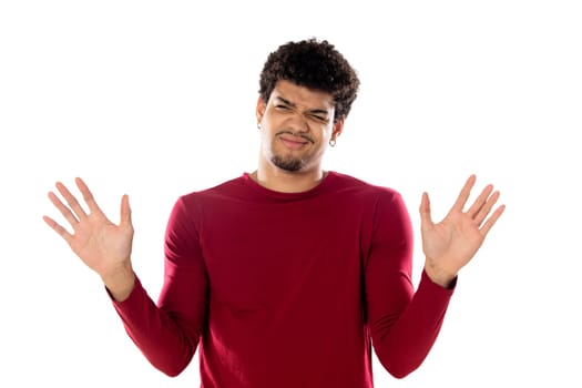 Cute african american man with afro hairstyle wearing a burgundy T-shirt isolated on a white background