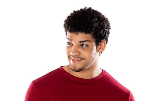 Cute african american man with afro hairstyle wearing a burgundy T-shirt isolated on a white background