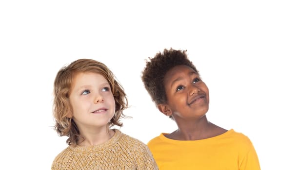 Pensive children looking up isolated on a white background