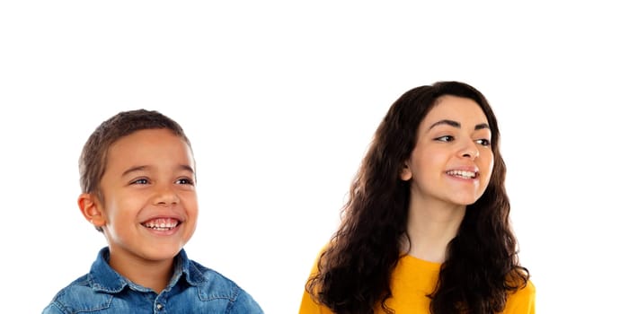Funny child with his higher sister isolated on a white background