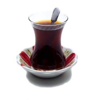 Brewed tea mixed with sugar spoon