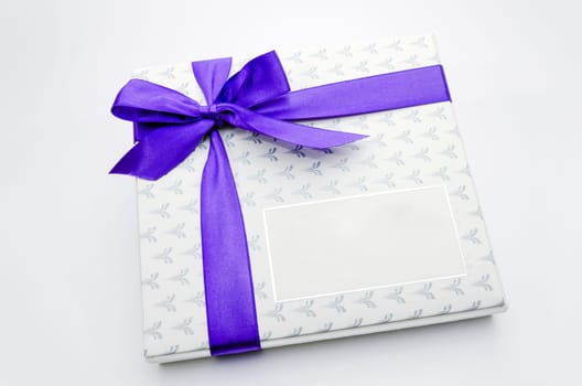 Printed over a purple ribbon gift box