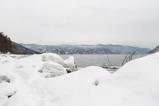 unfrozen Lake Teletskoye in winter. Russia Altai Krai.