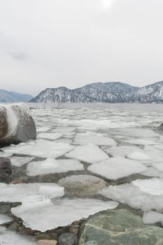 unfrozen Lake Teletskoye in winter. Russia Altai Krai.