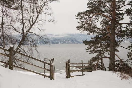unfrozen Lake Teletskoye in winter. Russia Altai Krai.