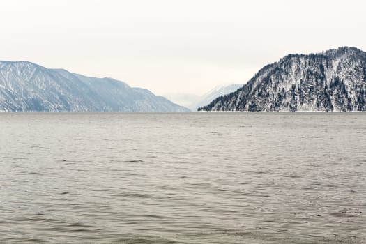 unfrozen Lake Teletskoye in winter. Russia Altai Krai.