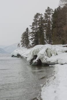 unfrozen Lake Teletskoye in winter. Russia Altai Krai.