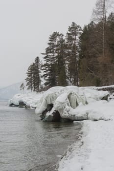 unfrozen Lake Teletskoye in winter. Russia Altai Krai.