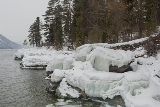unfrozen Lake Teletskoye in winter. Russia Altai Krai.