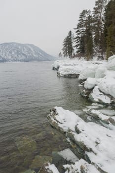 unfrozen Lake Teletskoye in winter. Russia Altai Krai.