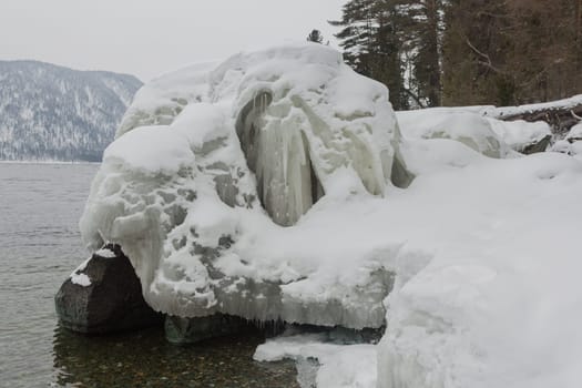 unfrozen Lake Teletskoye in winter. Russia Altai Krai.