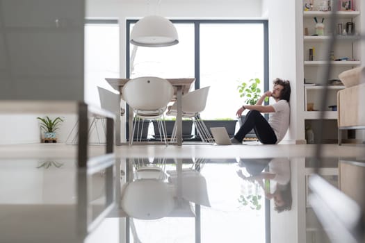 Real man Using laptop on the floor At Home  Enjoying Relaxing