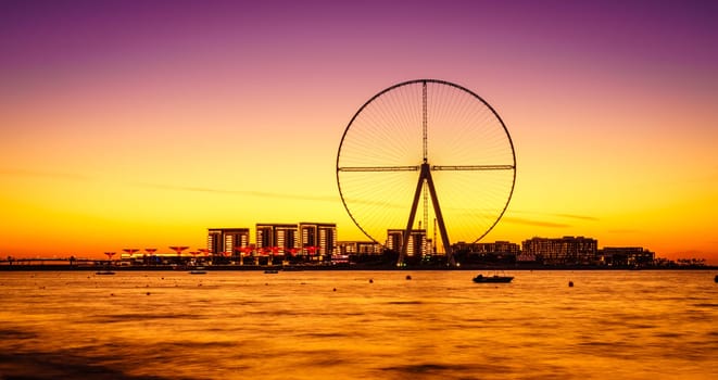 Twilight view of Bluewaters Island and Ain Dubai during construction, Dubai, UAE