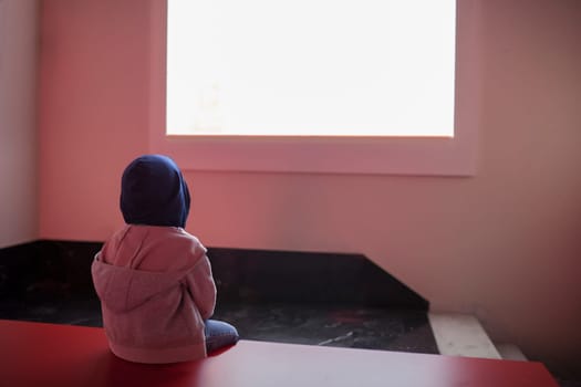 Child boy watching empty screen. Screen entertainment isolation concept