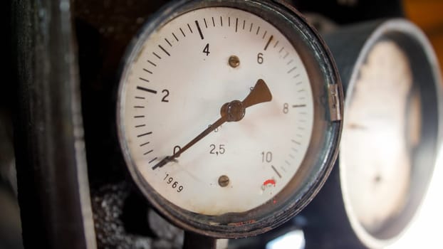 Closeup image of manometers showing steam pressure in old steam power train engine